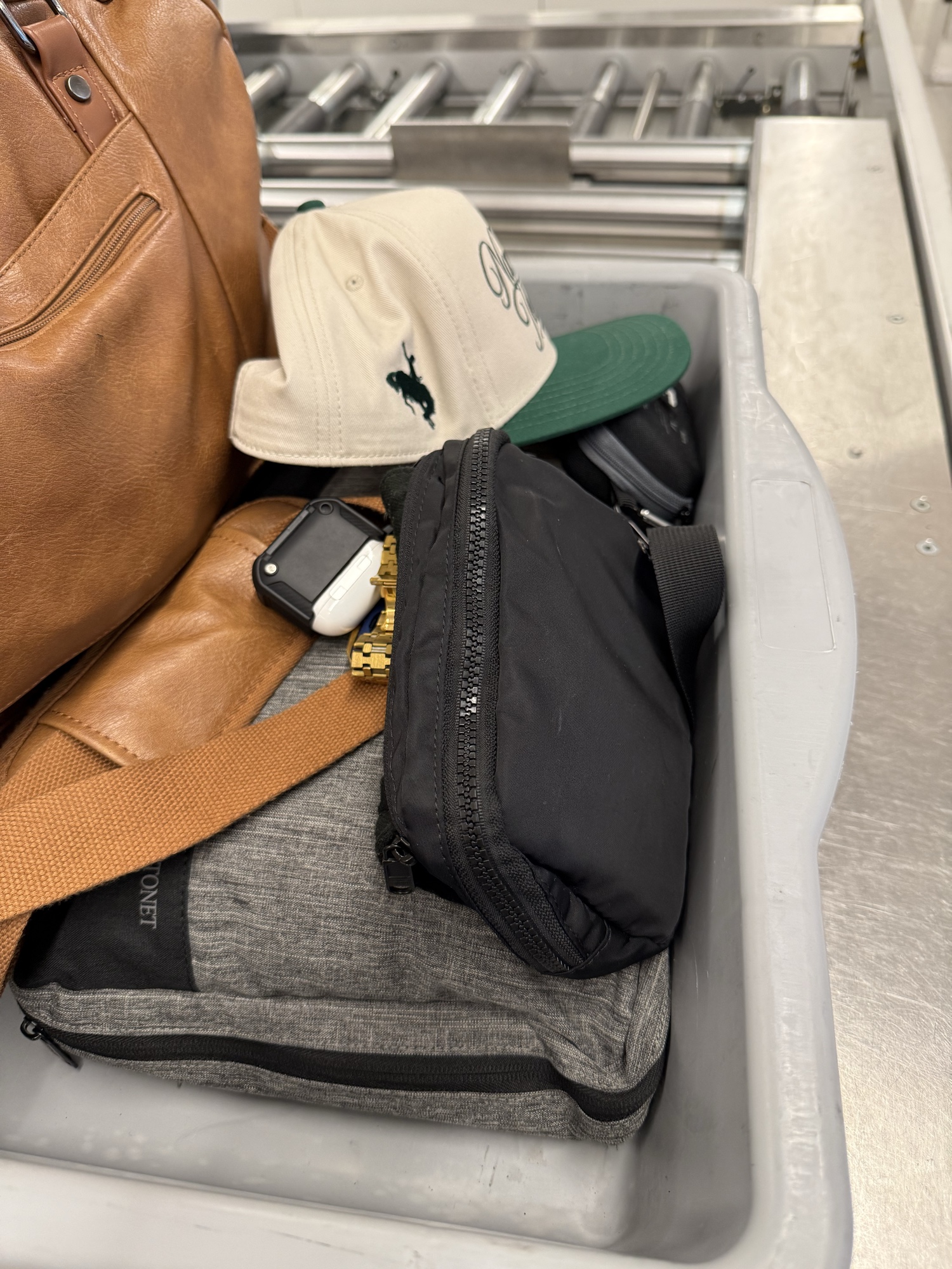 TSA security bin with TBK bag dropped in cleanly